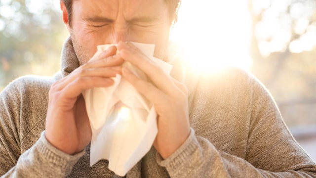 Man blowing his nose 