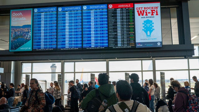 Passengers At Austin-Bergstrom International Airport In Austin, Texas.